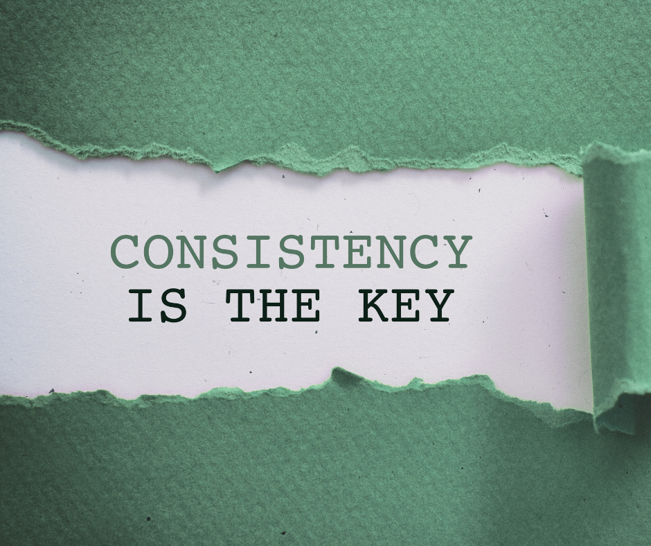 green paper torn to reveal the words on white paper: consistency is the key