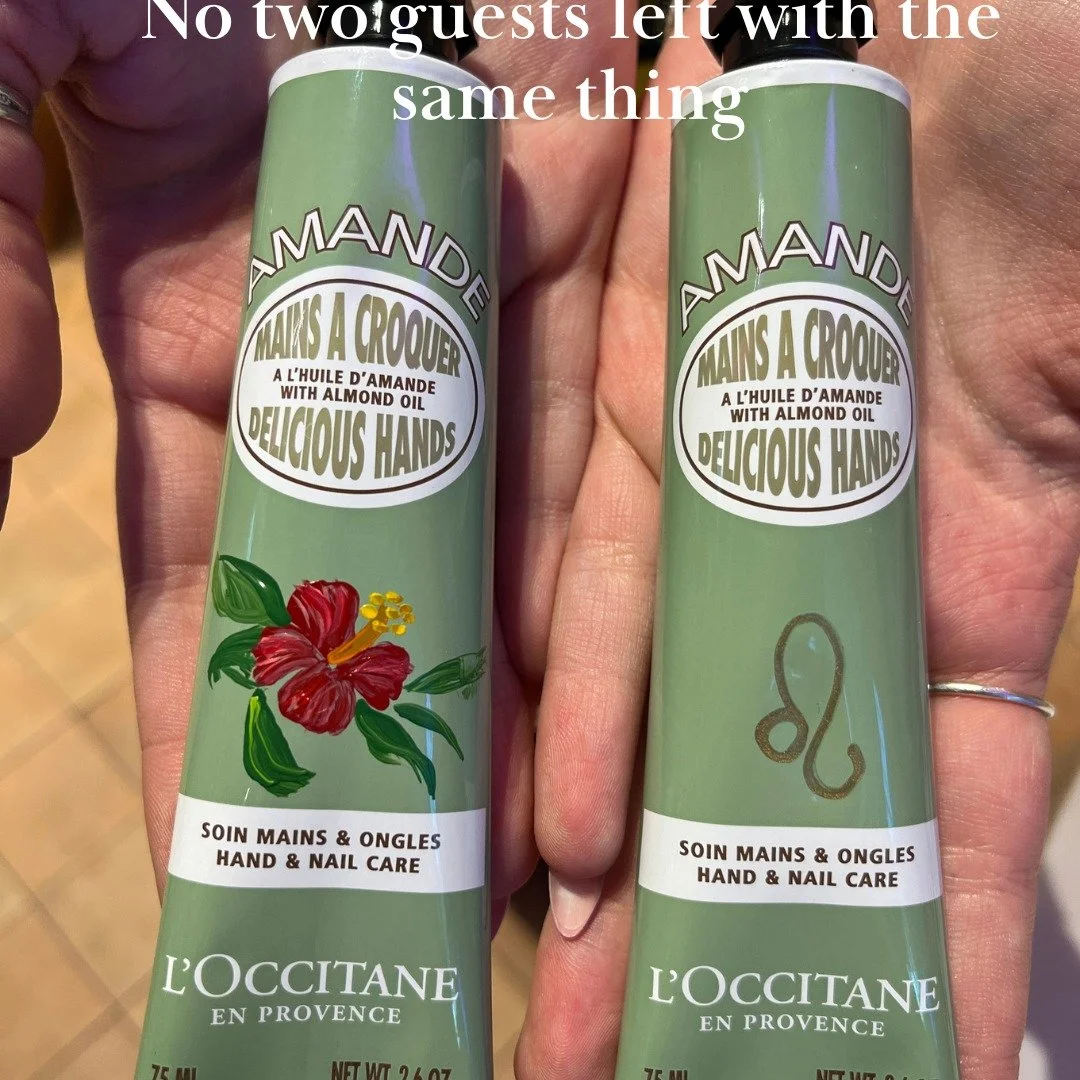 One hibiscus. One Leo symbol. Both painted live, by hand, in under three minutes &mdash; on their L'Occitane product, at the event, in front of them.
This is what I do. I turn a brand moment into something a guest keeps forever.

📍 Montr&eacute;al |
