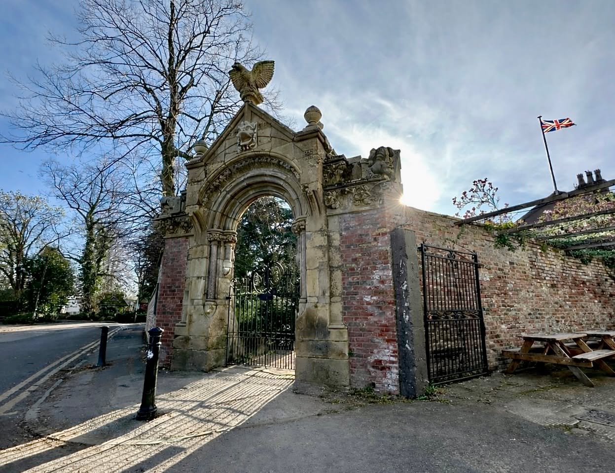 I went over to Fletcher Moss Gardens yesterday, specifically to take this photograph.

Of course, being a bank holiday, the road was full of cars, there were vapour trails overhead, signs on the gates, and even an old advertising sign leaning up agai