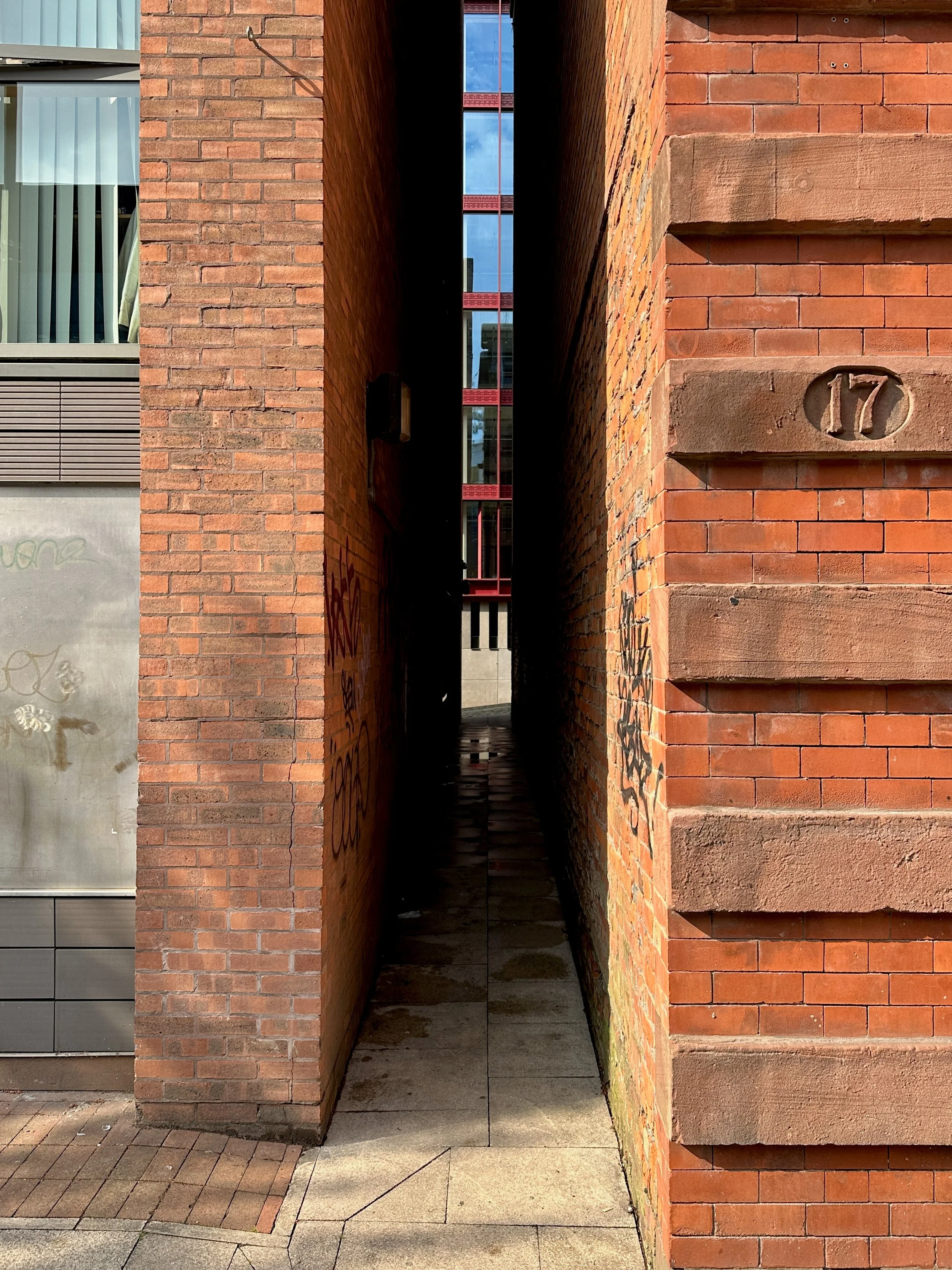 Is this the narrowest alleyway in Manchester?

This tiny passage runs between Whitworth Street West and the Rochdale Canal towpath.

I only spotted it for the first time back in 2009, when I took part in something called Street Training - an art and 