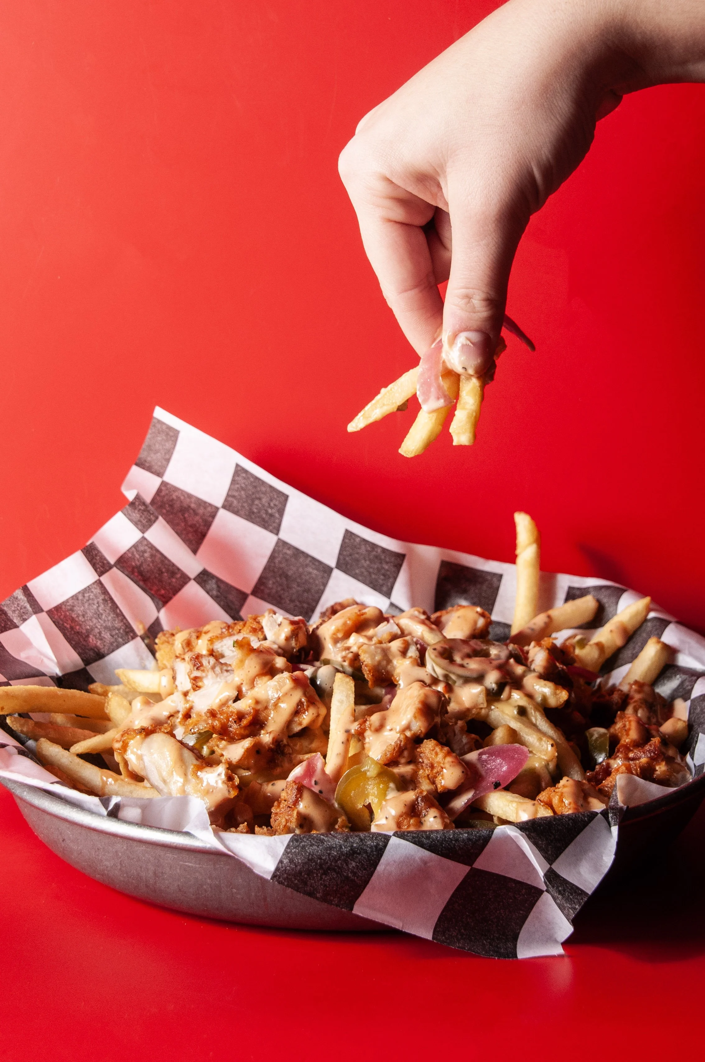 loaded fries with fries, cheddar poblano cheese sauce, comeback sauce, pickled red onion, jalapeño, scallions. choice of dipping sauce. pro tip: get it topped with fried chicken breast (nashville, sweet chili, or classic)!