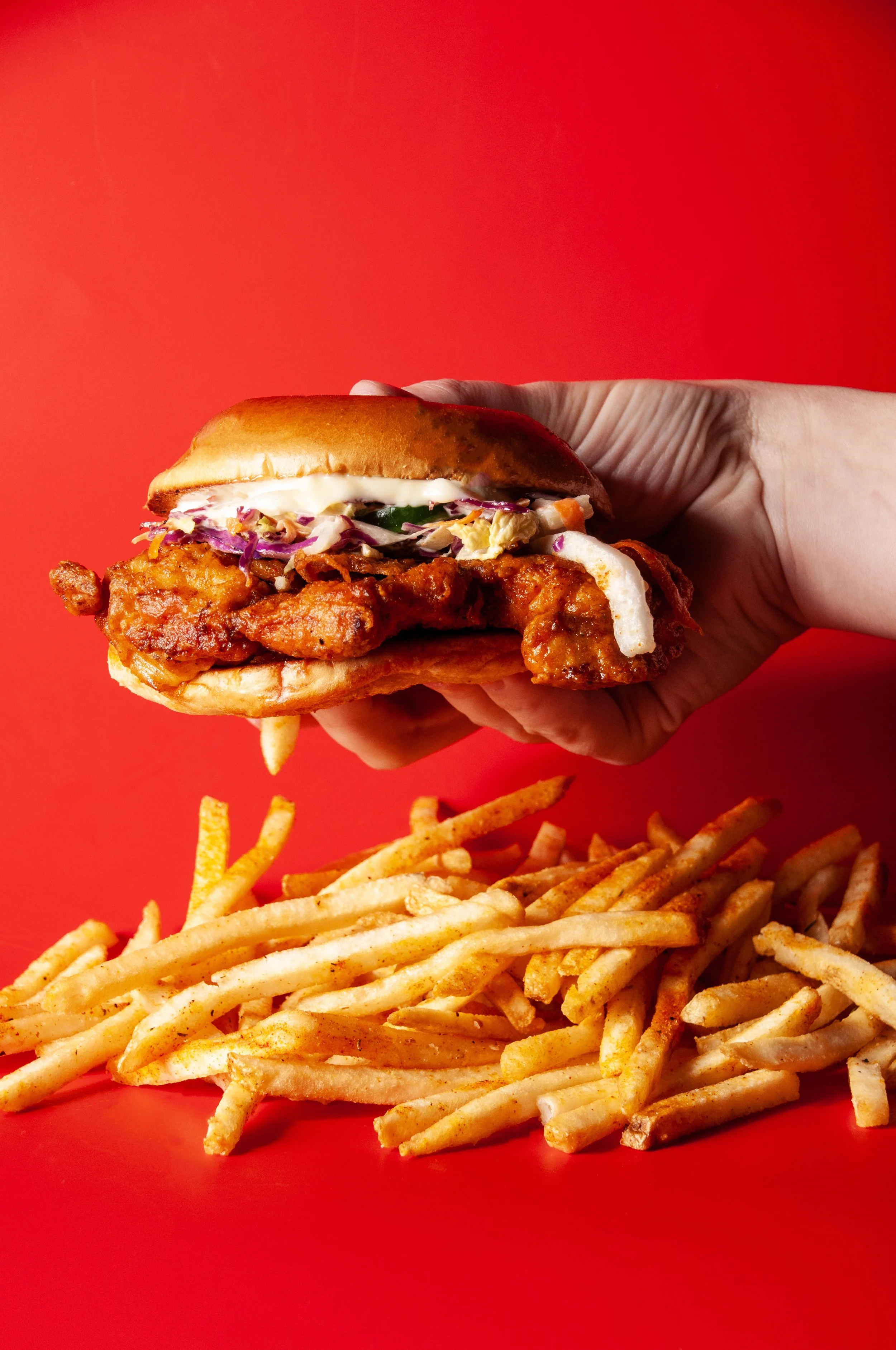 Nashville Hot chicken sandwich with fried chicken breast dipped in hot chili oil, jalapeño slaw, bread & butter pickles, garlic aioli, brioche bun. choice of side.