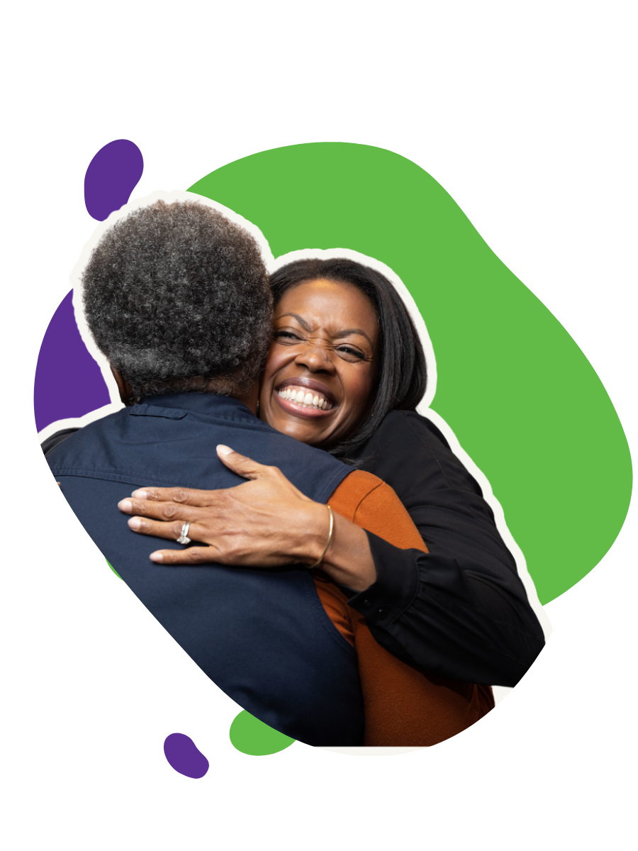 Two people  smiling and showing emotion.