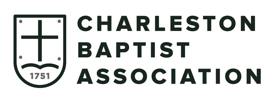 Logo of Charleston Baptist Association featuring a shield with a cross and an open book, and the text 'CHARLESTON BAPTIST ASSOCIATION' beside it.
