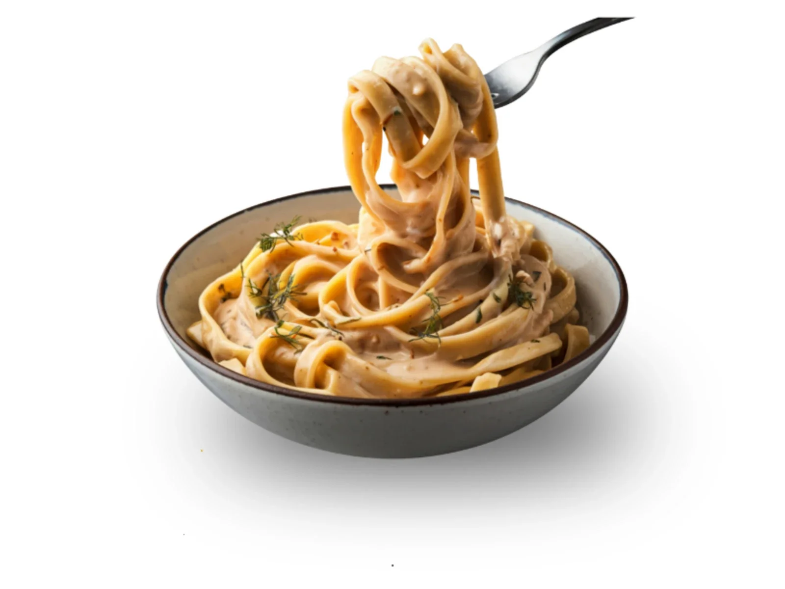 Bowl of fettuccine pasta with creamy sauce and herbs, with a fork lifting a portion of pasta.