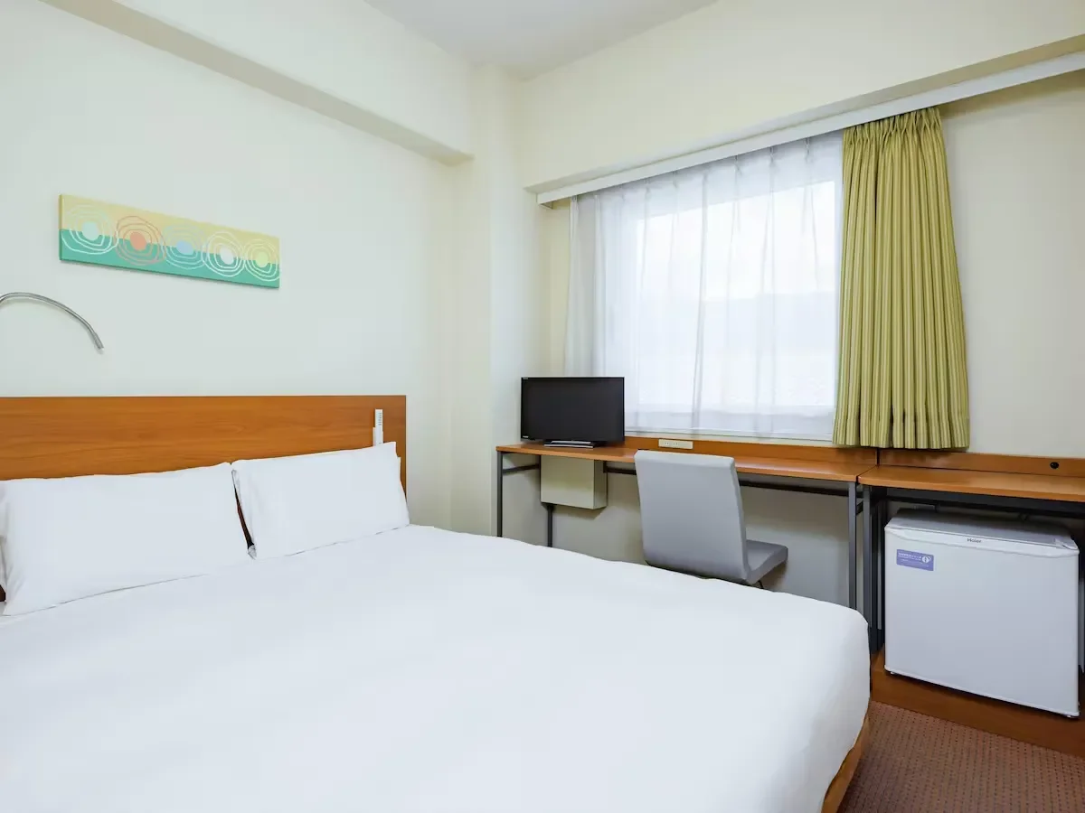 the bed room in comfort inn suwa inter in kanazawa