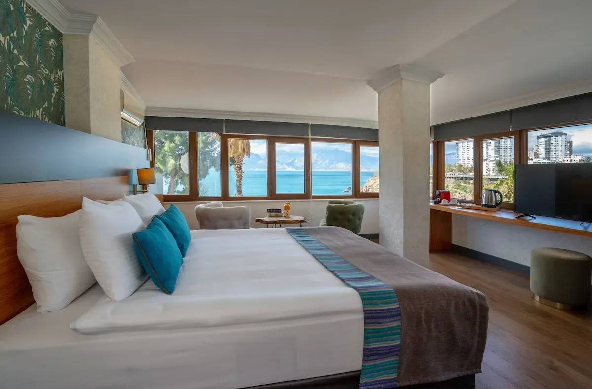 bed room with large bed and sea view in qinn hotels antalya