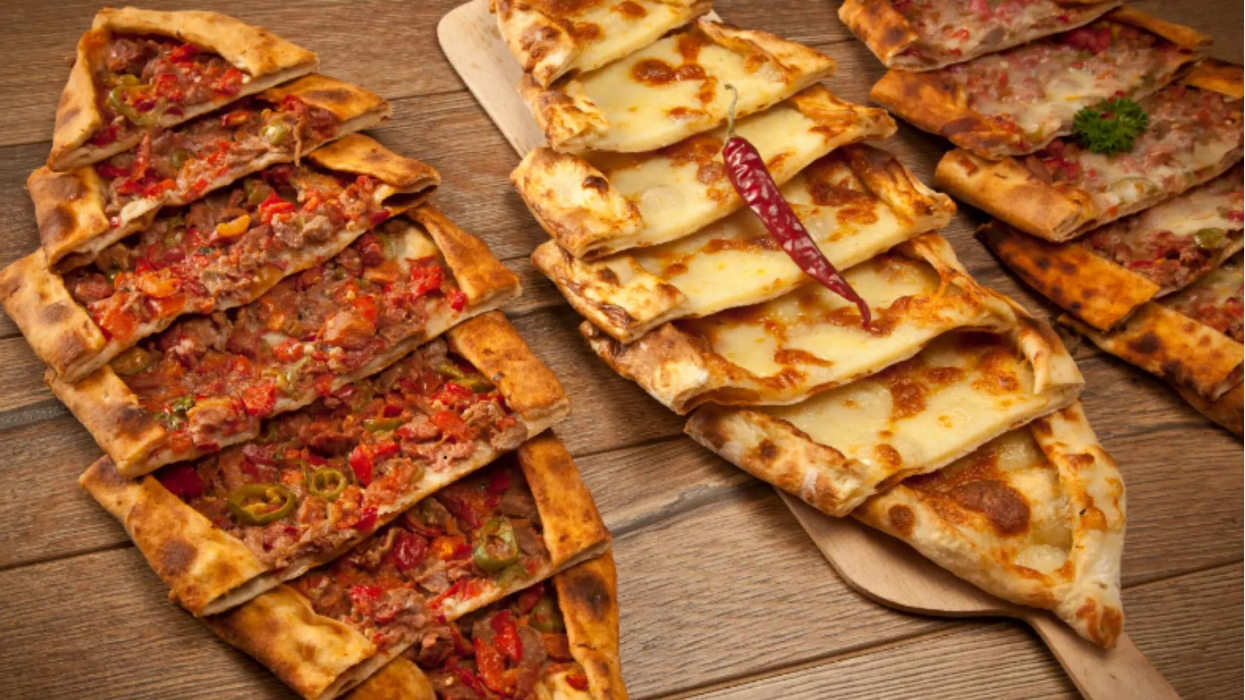 Turkish pide flatbread baked in a stone oven with cheese and meat — a signature dish in Turkish cuisine.