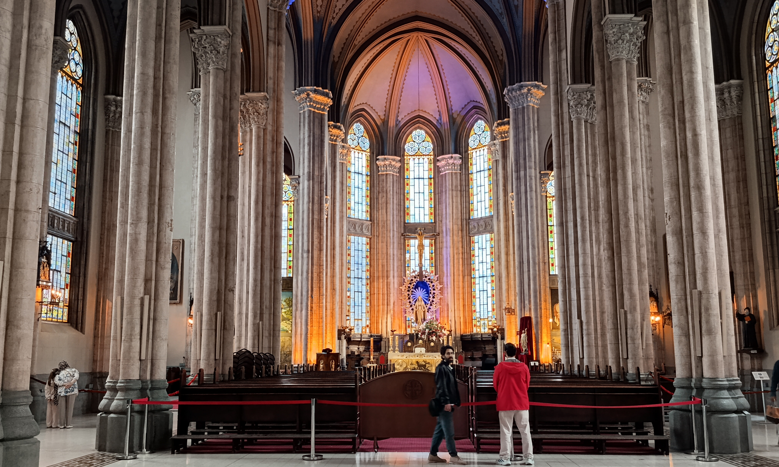 Interior of St. Antoine Church showing blue vaulted ceilings and stained glass