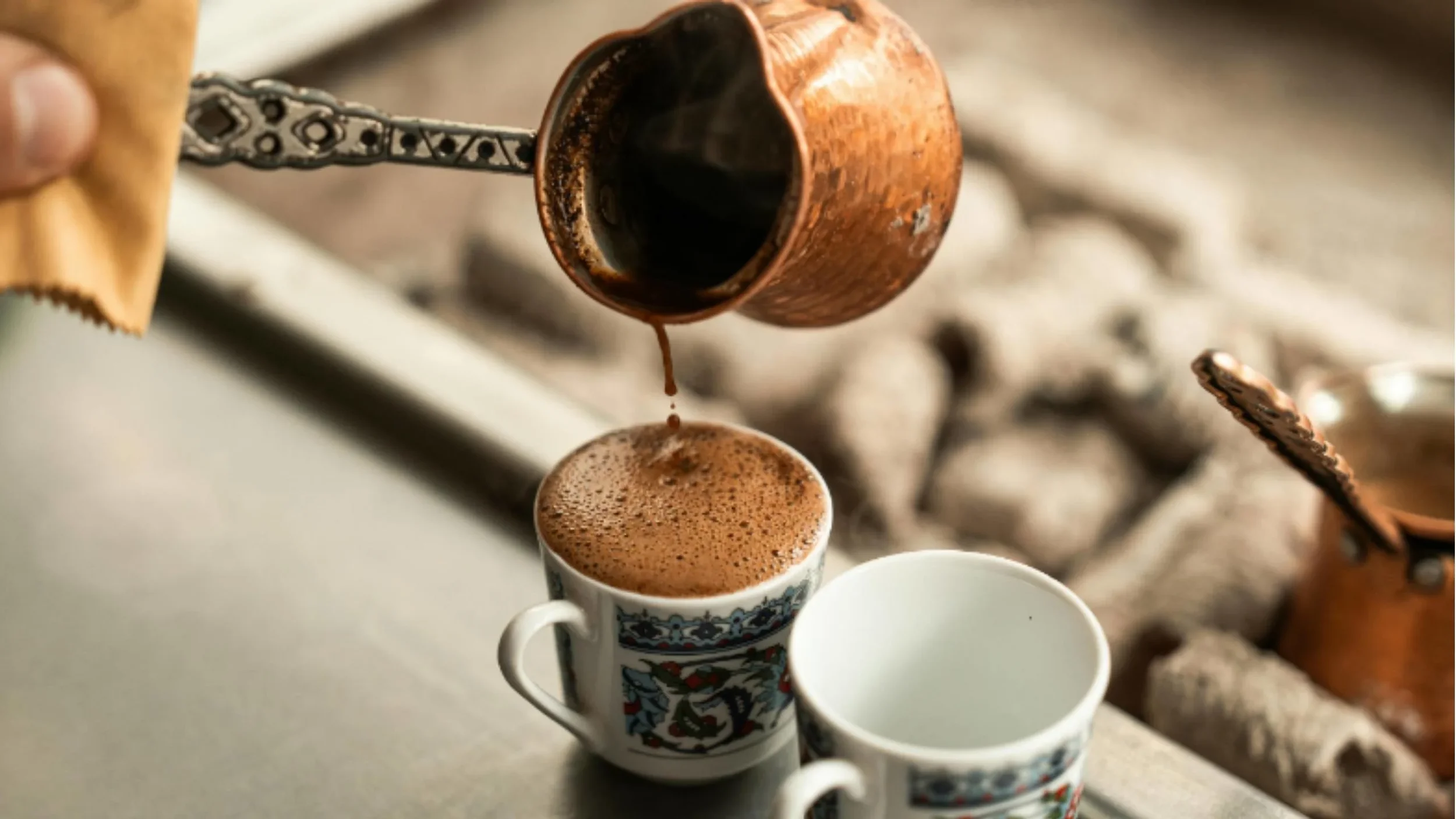 Traditional Turkish tea and coffee served in tulip glasses and copper cups — iconic symbols of Turkish hospitality.