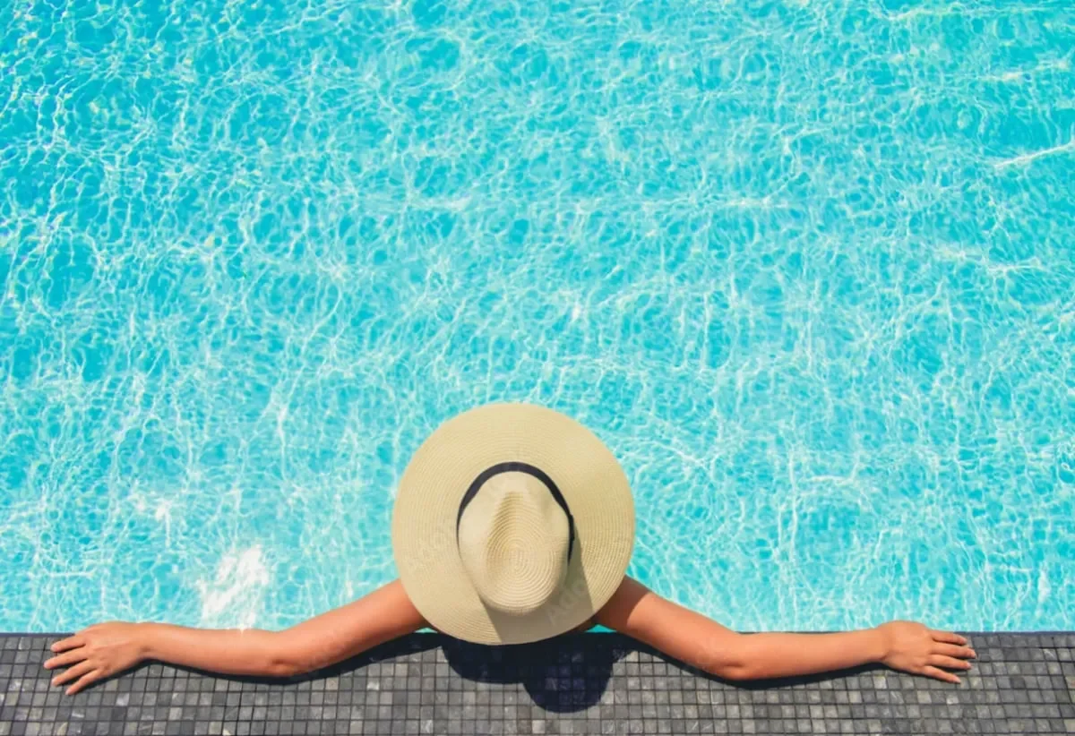 a girl laying in the pool side in azuu hotel in antalya