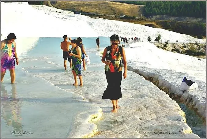 barefoot walkers on the water in pamukkale