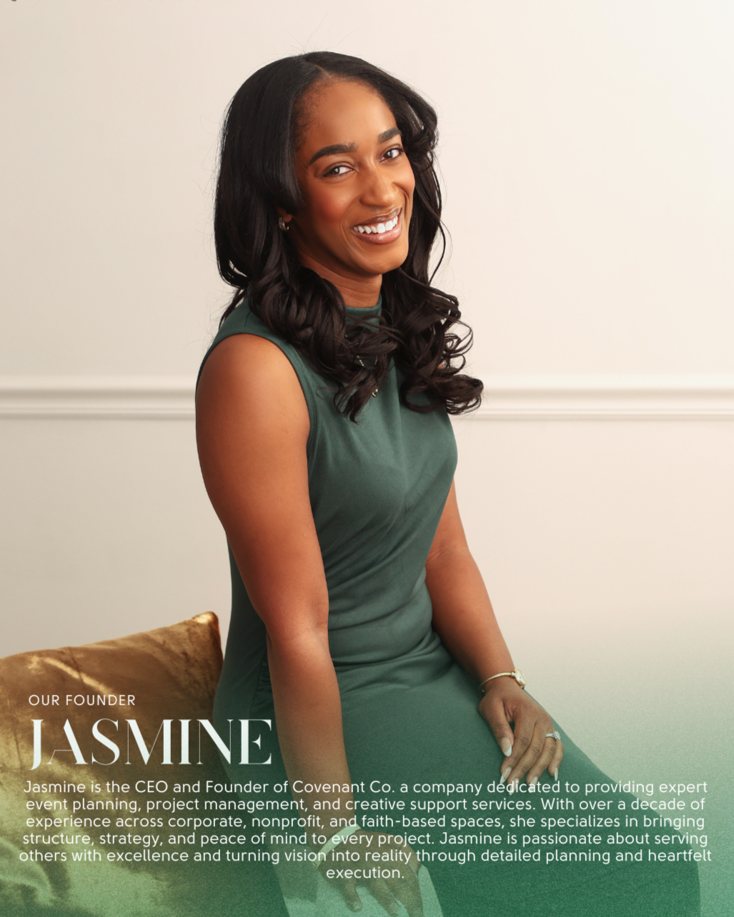 Portrait of Jasmine, CEO and Founder of Covenant Co., sitting on a beige cushion, smiling in a green sleeveless dress, with a white wall background.