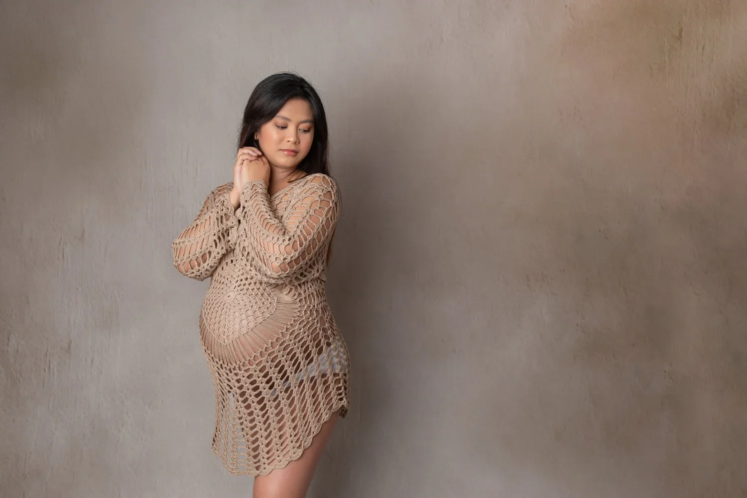 Beachy Mama Cape 
 Color:  Sand  Size:  One Size  Coverage:  Partial Coverage 

This is a long-sleeved knitted cape that is completely see through. Nude panties and strapless work best for this dress.