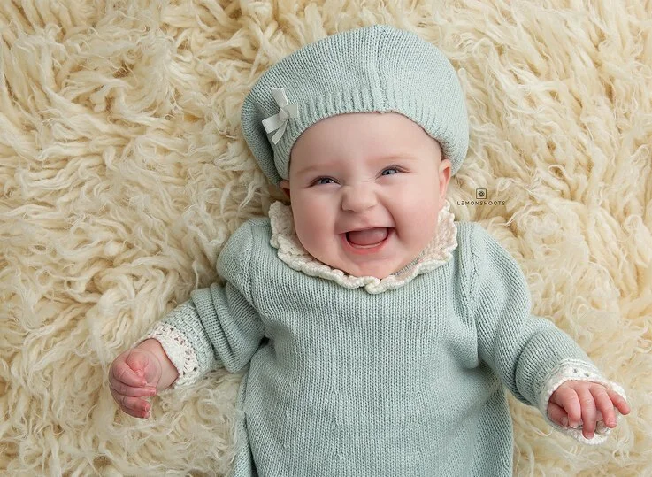 Cute smiling baby in a beret