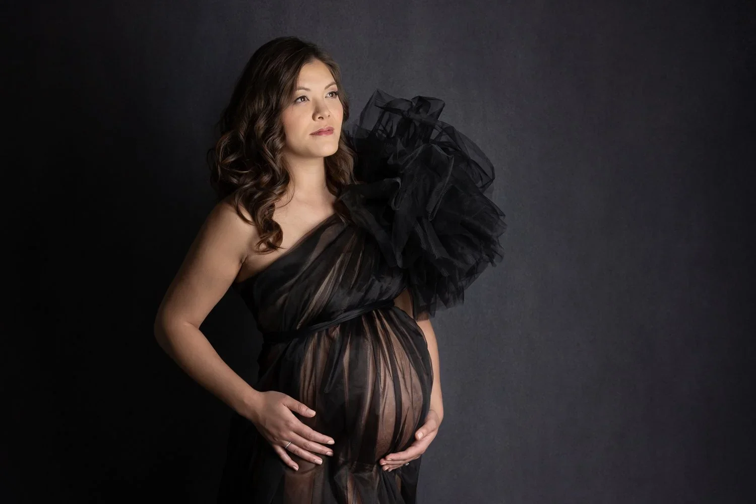 Vogue Mama 
 Color:  Black  Size:  Average  Coverage:  Partial Coverage 

This tulle gown falls on one shoulder with a very dramatic accent. It falls almost straight all the way to the floor. Nude panties and strapless work best for this dress.