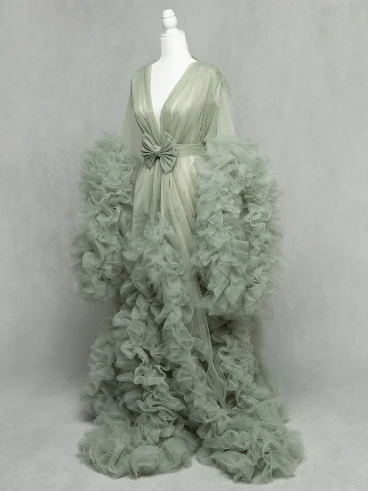 Ravishing Mama 
 Color:  Sage  Size:  Average  Coverage:  Partial Coverage 

This gown has long, ruffled sleeves and skirt. It is open in the front to allow for exposed belly. Nude panties and strapless work best for this dress.