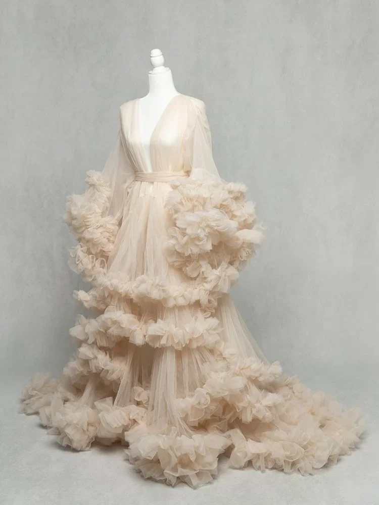 Flourishing Mama 
 Color:  Ivory  Size:  Average  Coverage:  Partial Coverage 

This gown has long, ruffled sleeves and skirt. It is open in the front to allow for exposed belly. Nude panties and strapless work best for this dress.