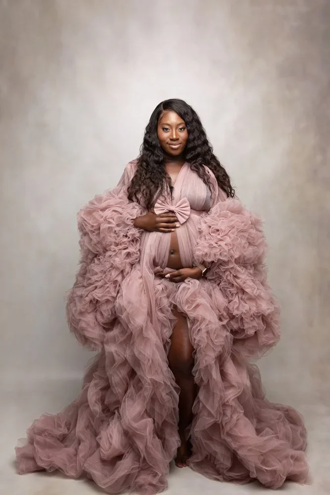 Ravishing Mama 
 Color:  Mauve  Size:  Average  Coverage:  Partial Coverage 

This gown has long, ruffled sleeves and skirt. It is open in the front to allow for exposed belly. Nude panties and strapless work best for this dress.
