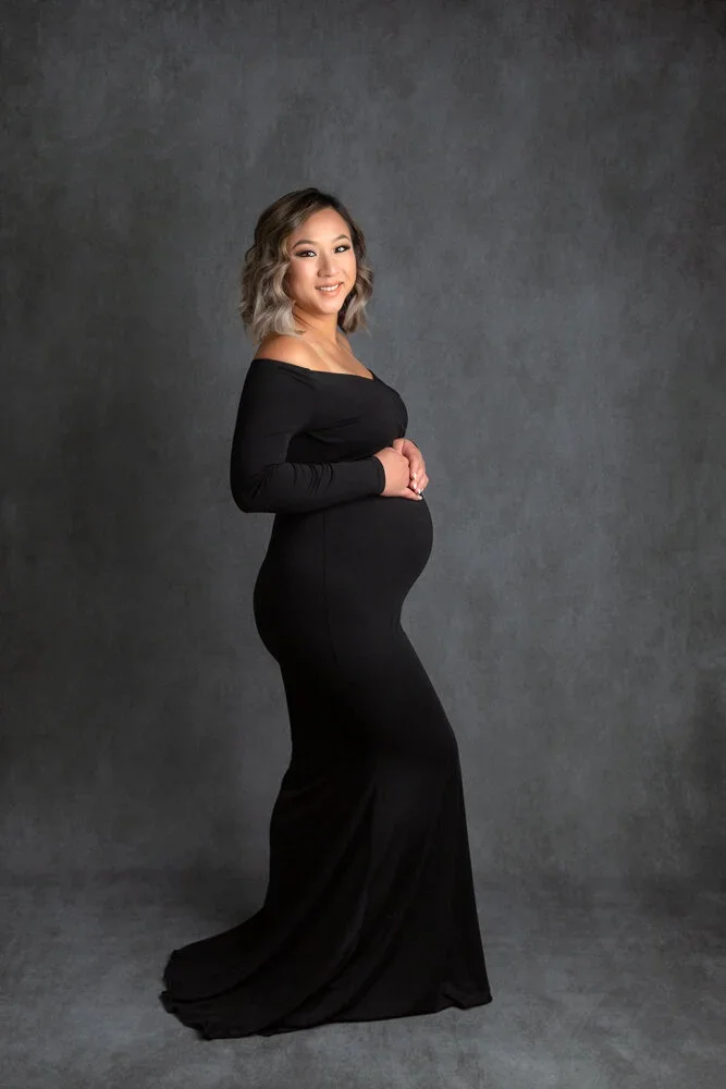 Goddess Mama 
 Color:  Black  Size:  Petite  Coverage:  Full Coverage 

This gown has long sleeves and fits comfortably. Nude panties and strapless work best for this dress.