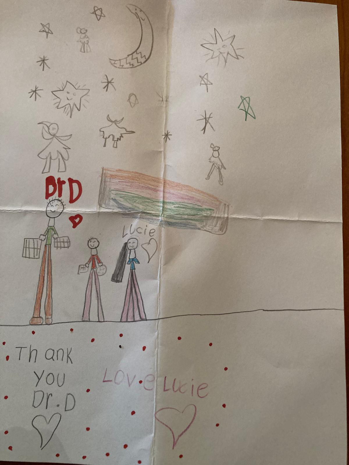 Lucie's drawing 
Alternate text: A picture drawn by a patient with the written message "Thank you Dr. D. I love you. Lucy"