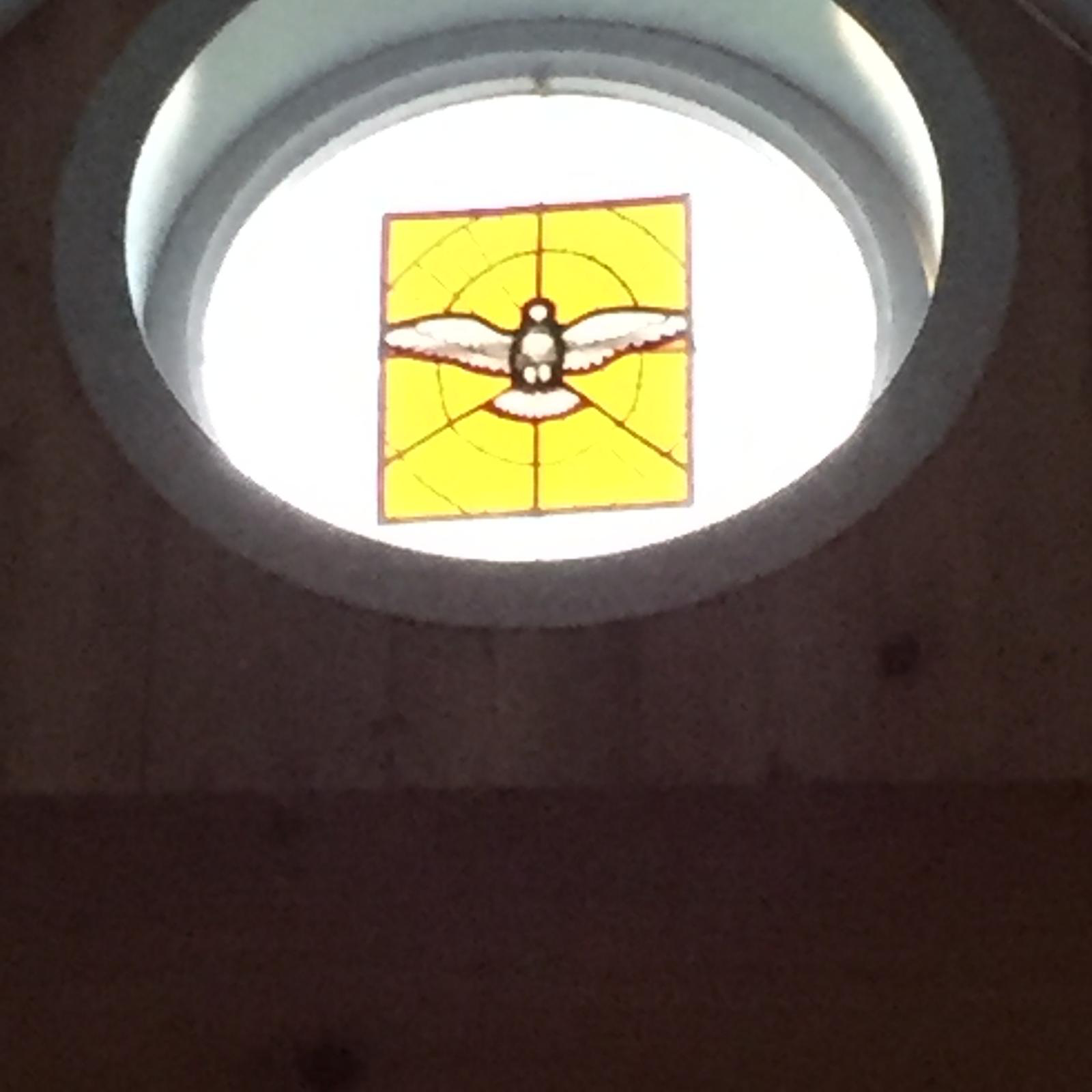 Holy Spirit window over the door of the Chapel