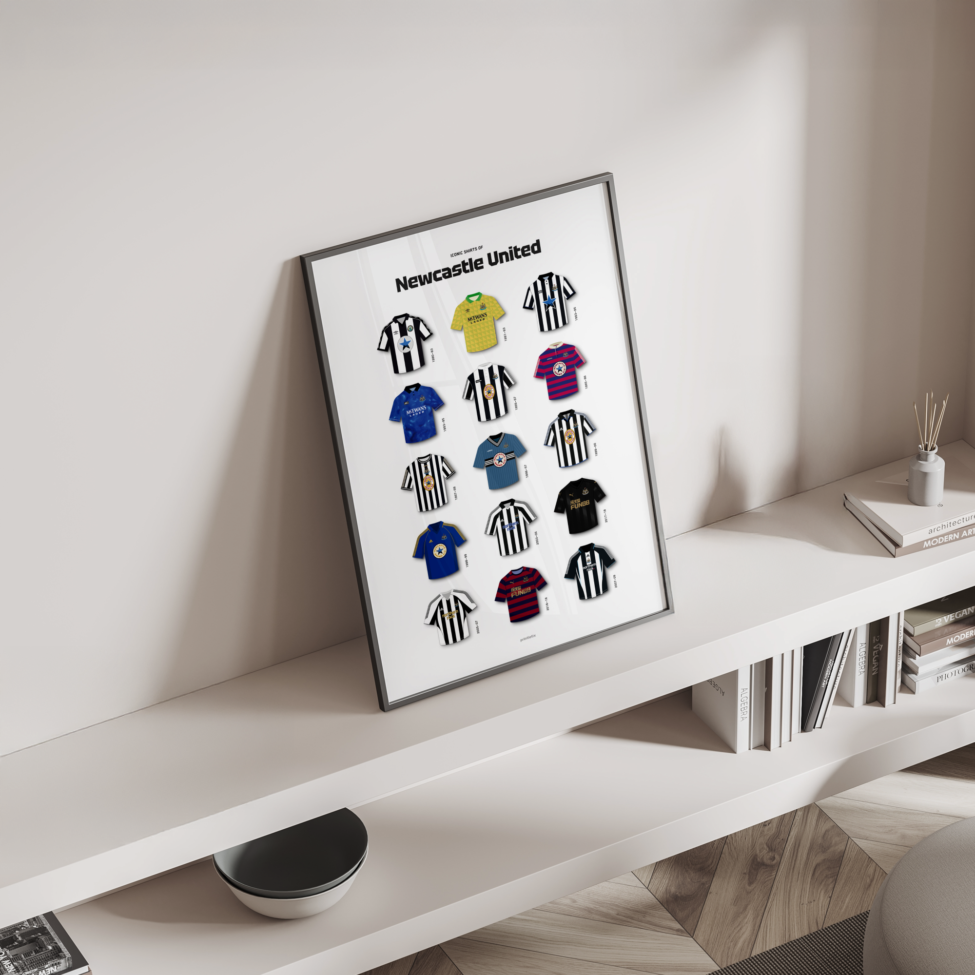 Magpies iconic kits poster standing on a shelf