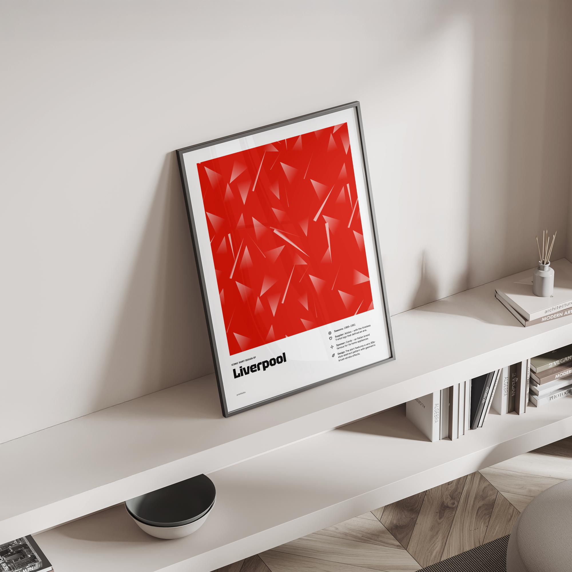 Liverpool’s “Triangle” shirt poster standing on a shelf