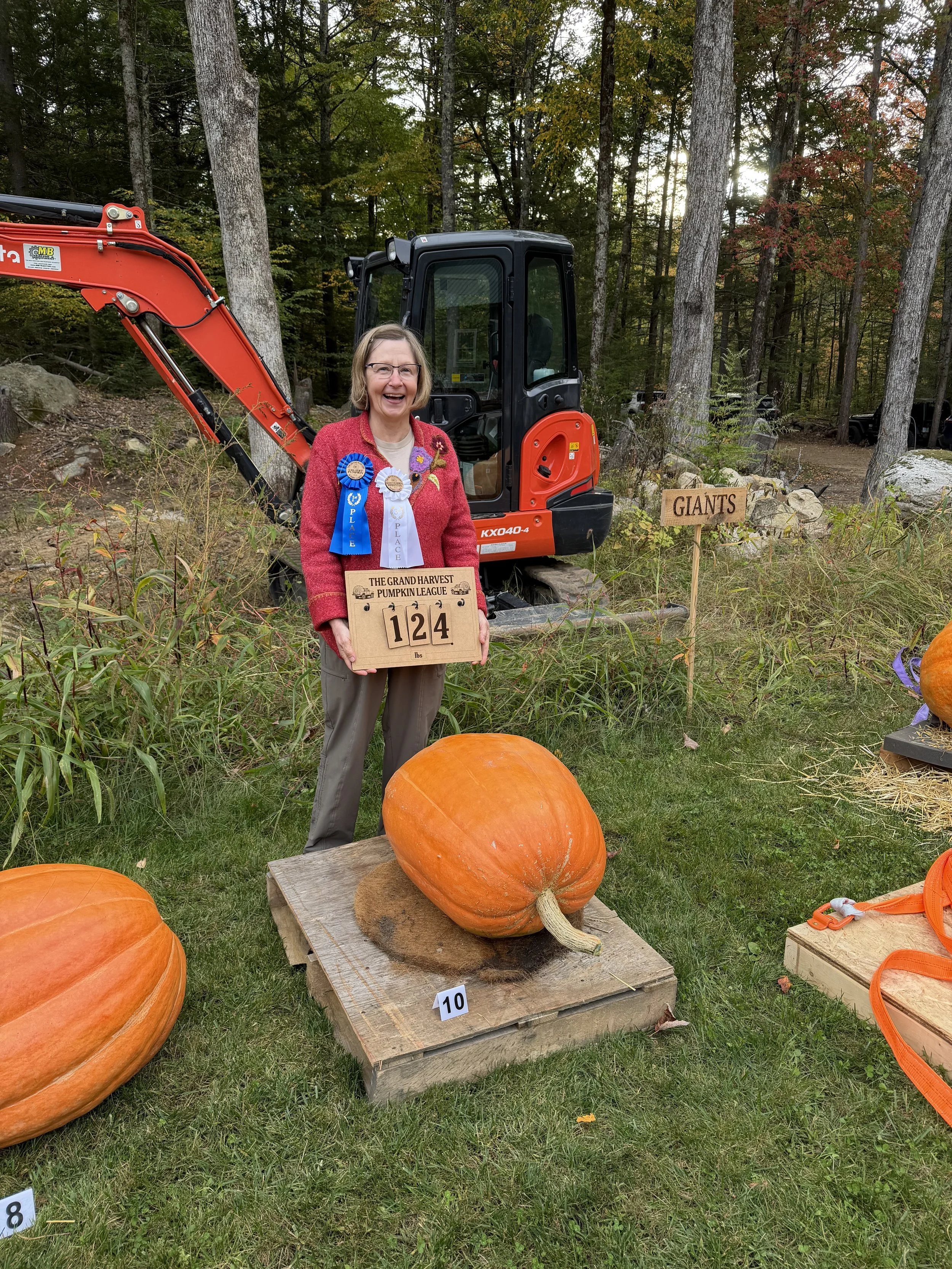 3rd Place Giant Pumpkin Competition - Brenda with her 124-lb giant 