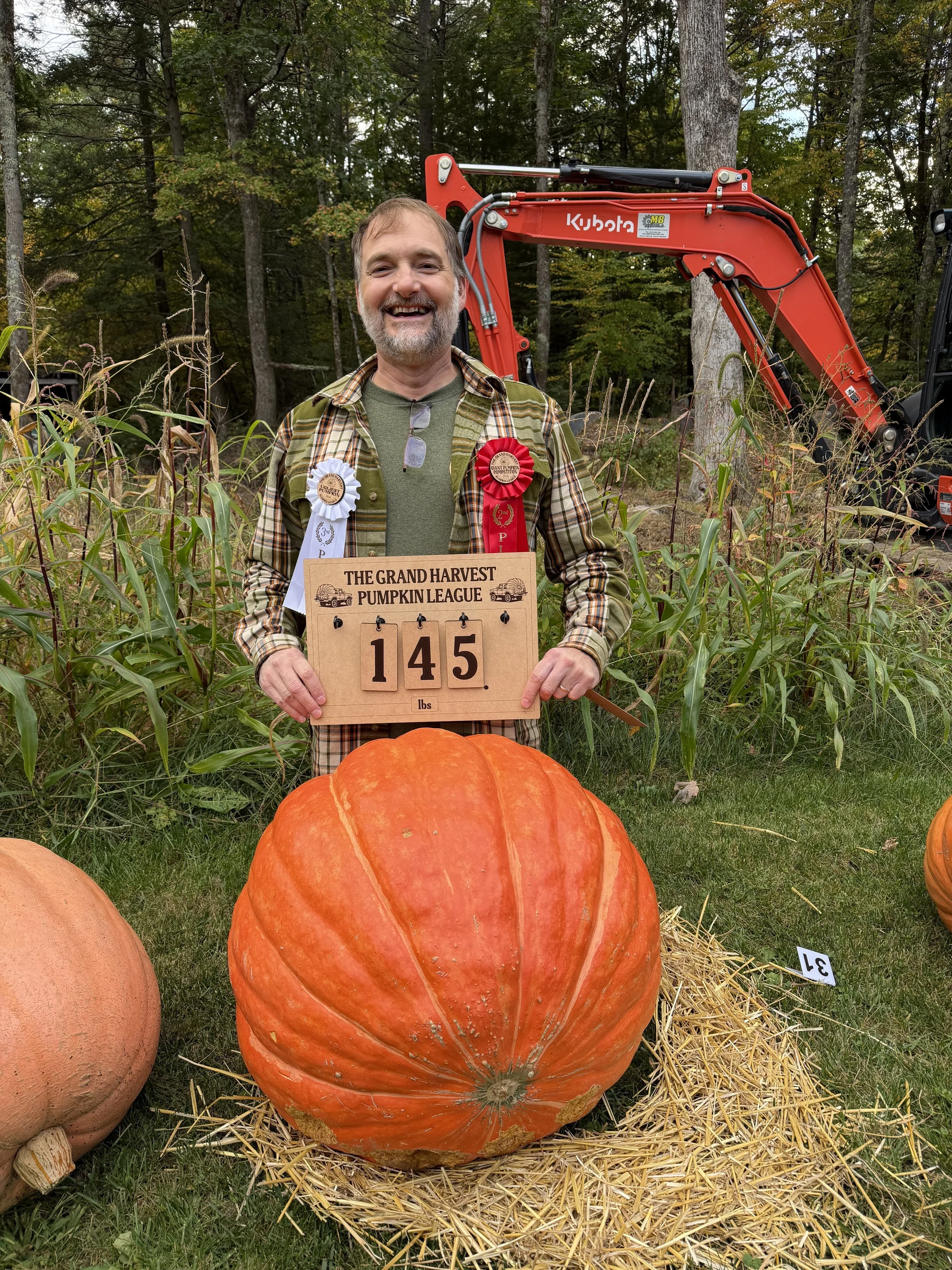 2nd Place Giant Pumpkin Competition - Chris with his 145-lb giant 
