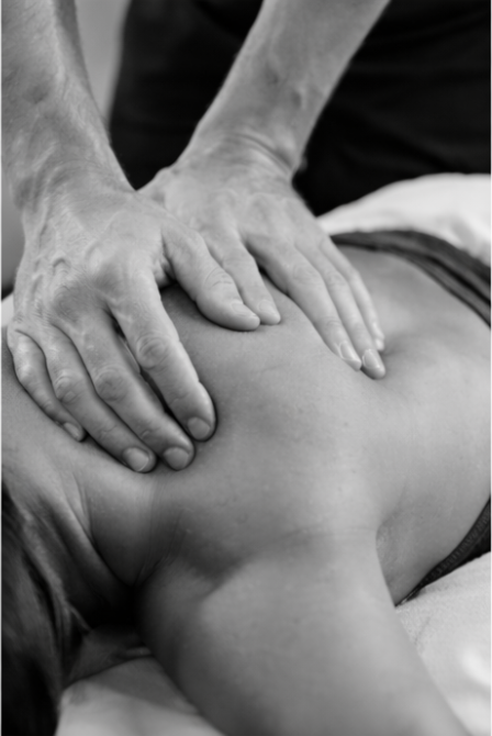 Person receiving a back massage from a massage therapist