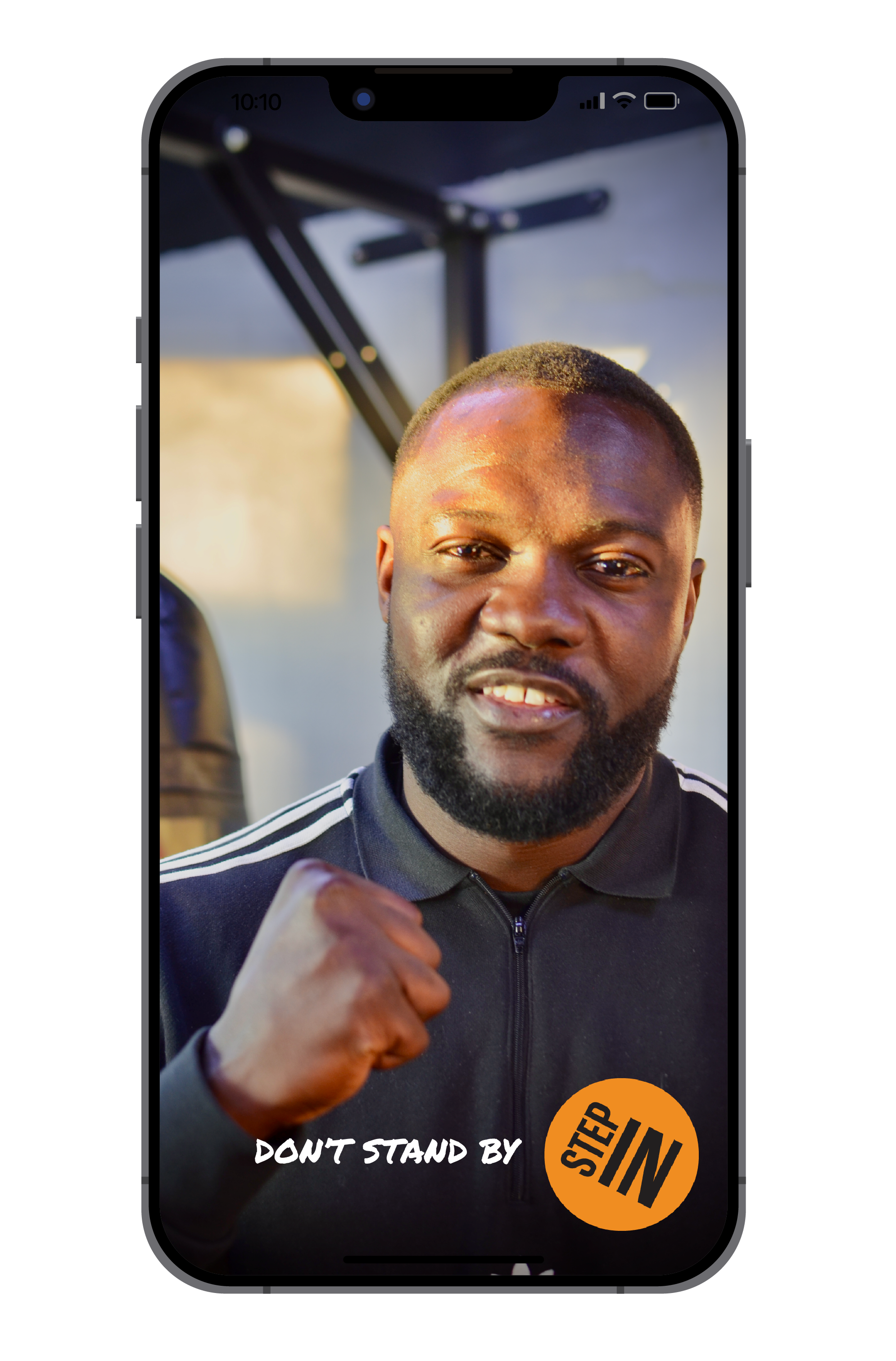 Phone screen showing man with fist clenched, with writing 'don't stand by Step IN'