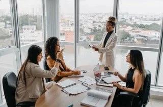 empowered woman running a meeting
