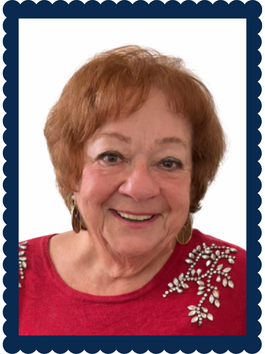 Framed photo of Barbara Berlin in front of a Christmas Tree