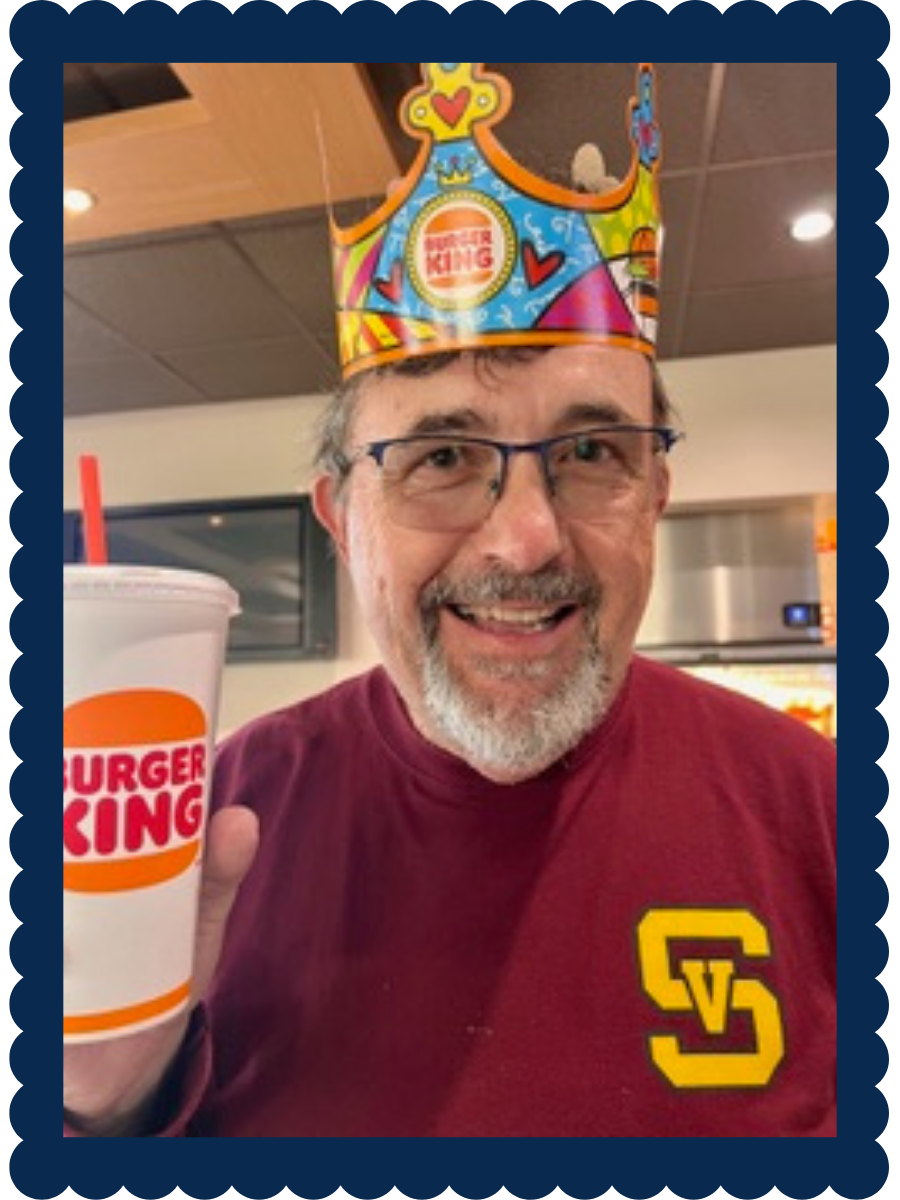 Framed photo of Tim Frazier wearing a Burger King hat