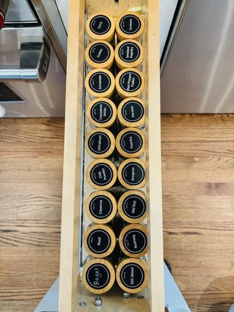 Pull-out spice rack with matching jars and labels so finding spices is easier!