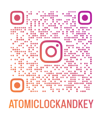 Colorful Instagram QR code with the text "ATOMICLOCKANDKEY" beneath it.