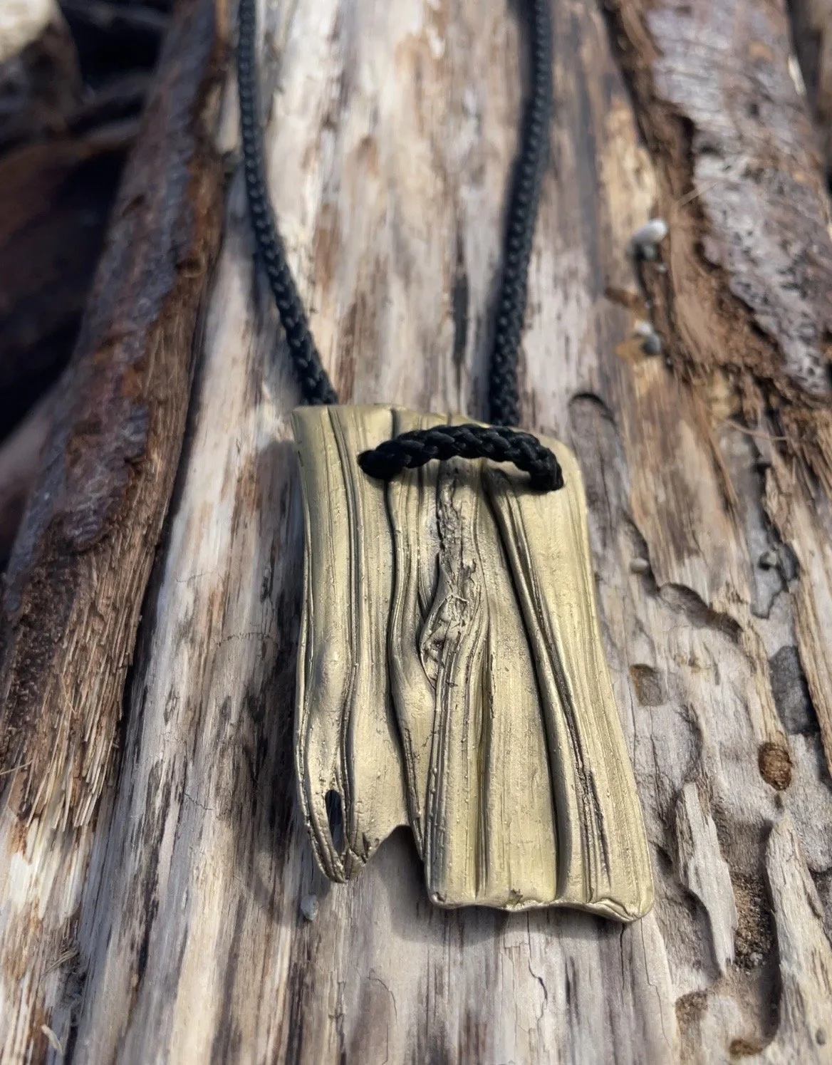 Flow sculptural bronze pendant necklace by Mel Mueller Jewellery, handcrafted using Mitsuro Hikime technique and suspended from natural rope and brass chain.