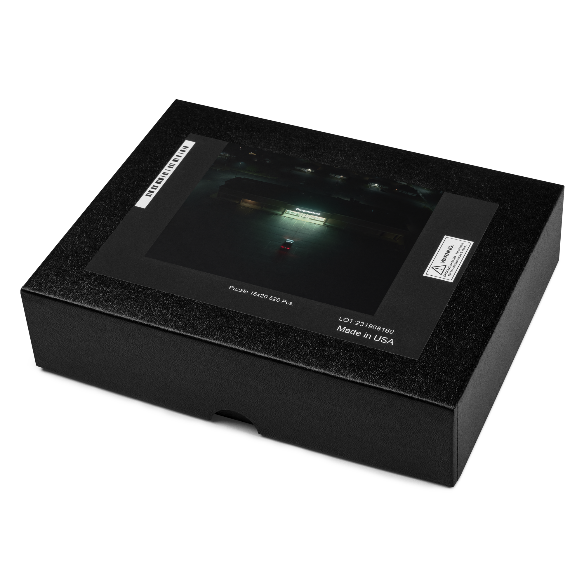 Puzzle - Fluorescent - Black jigsaw puzzle box. Lid features artwork of a dark, rainy parking lot with a brightly lit sign reading 'Computerland'.