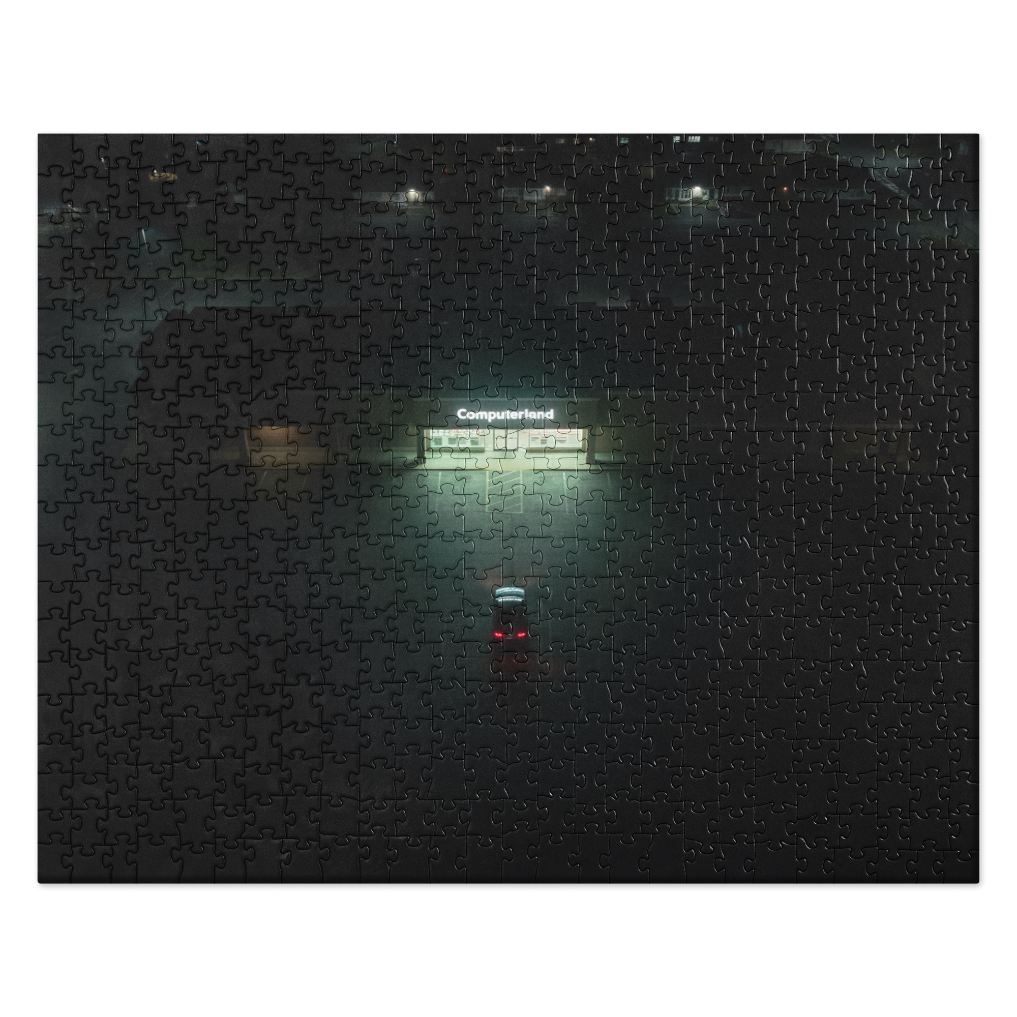 Puzzle - Fluorescent - Completed jigsaw puzzle. Artwork depicts a moody night scene with a lone car parked in front of a glowing 'Computerland' storefront in the rain.