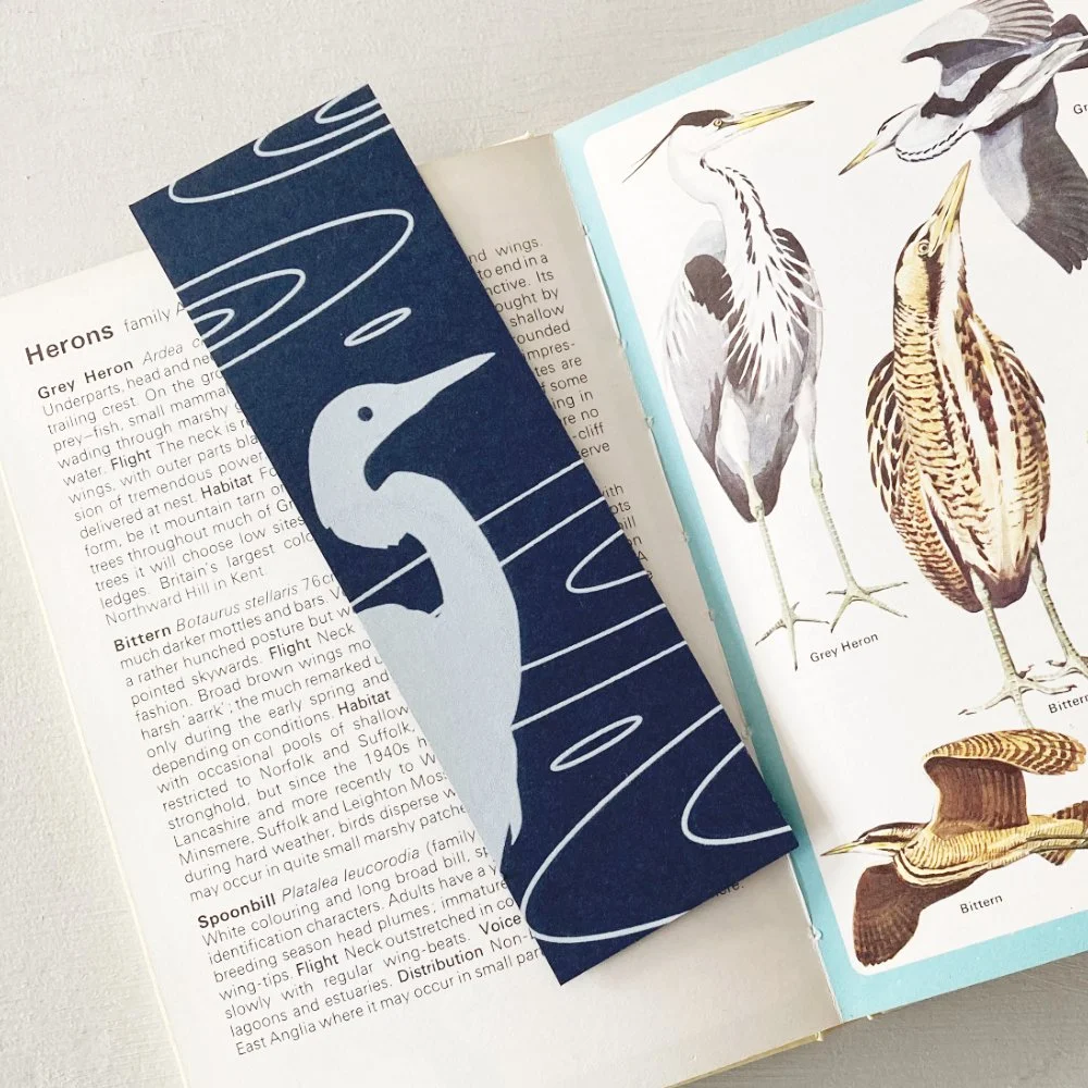 Egret bookmarks propped book sq sm.jpg