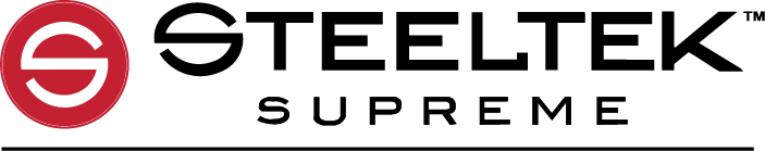 A close-up of a hand holding a pair of glasses and a notebook on a desk with a cup of coffee.