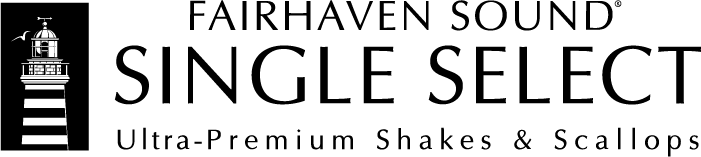 A black dog wearing yellow sunglasses and a yellow bandana, standing on grass.