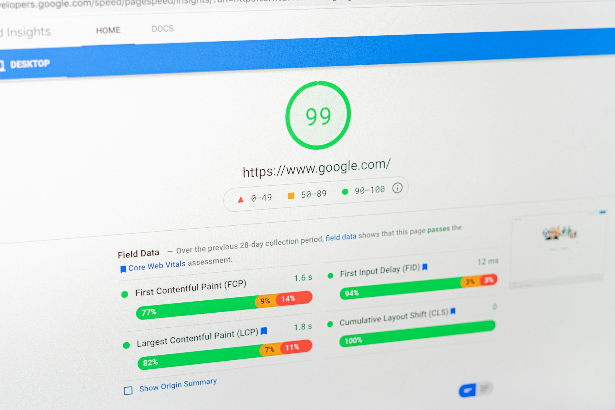 Computer screen displaying Google PageSpeed Insights with a score of 99 in a green circle. The page shows website performance metrics, with color-coded indicators and percentages for various web performance parameters.