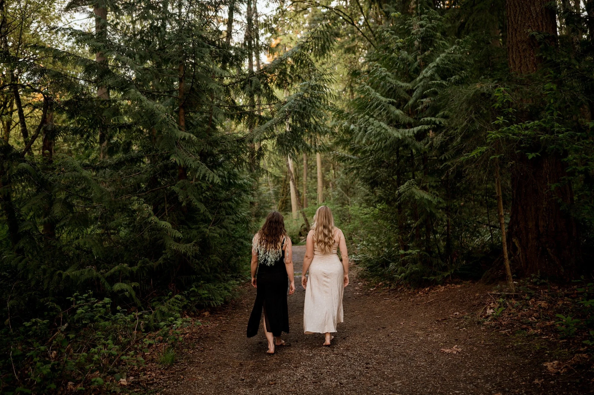 two women therapists walking down a wooded path in a Chicago forest