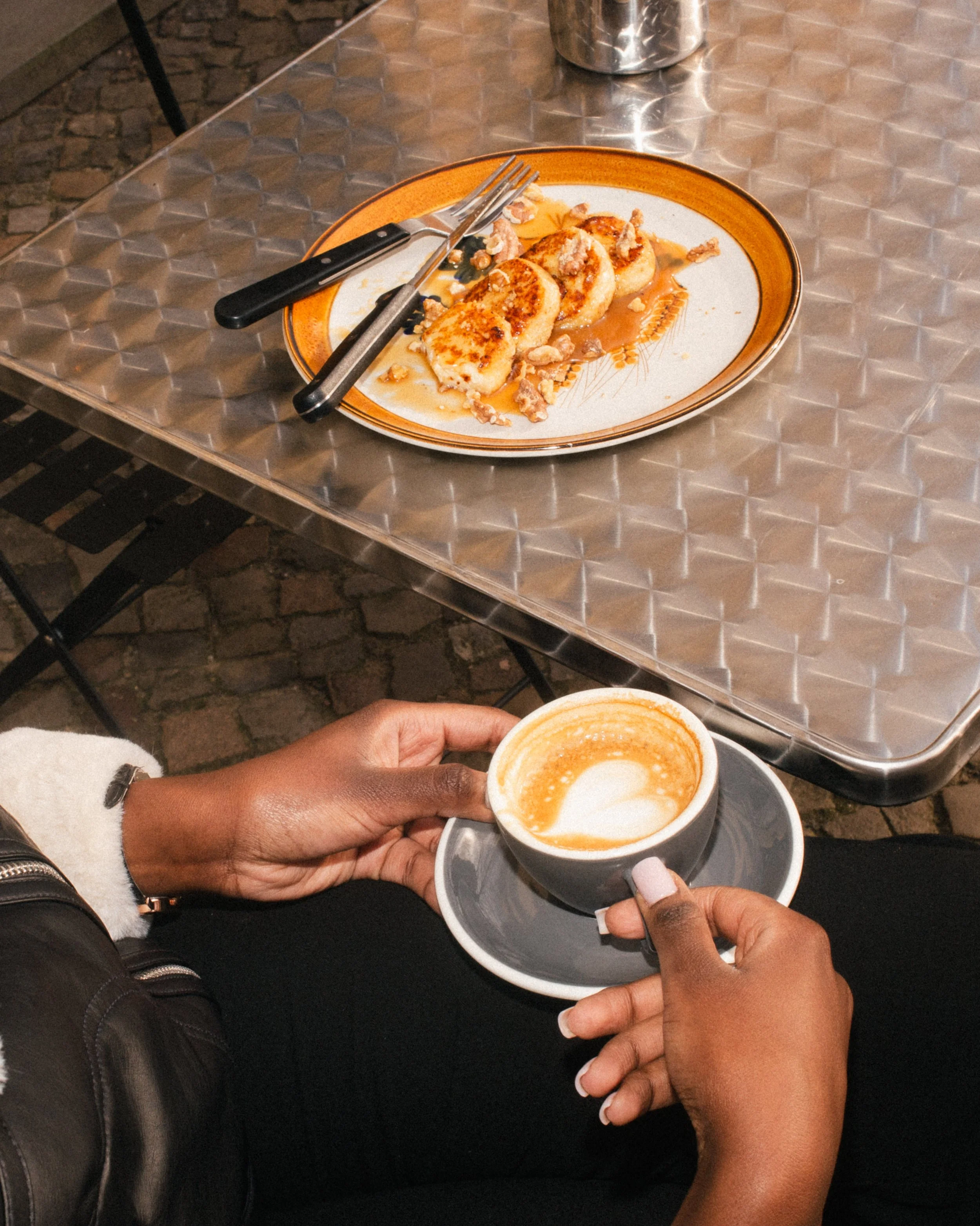 Morning coffee and pancakes at an outdoor cafe in Berlin, stylish brunch scene.