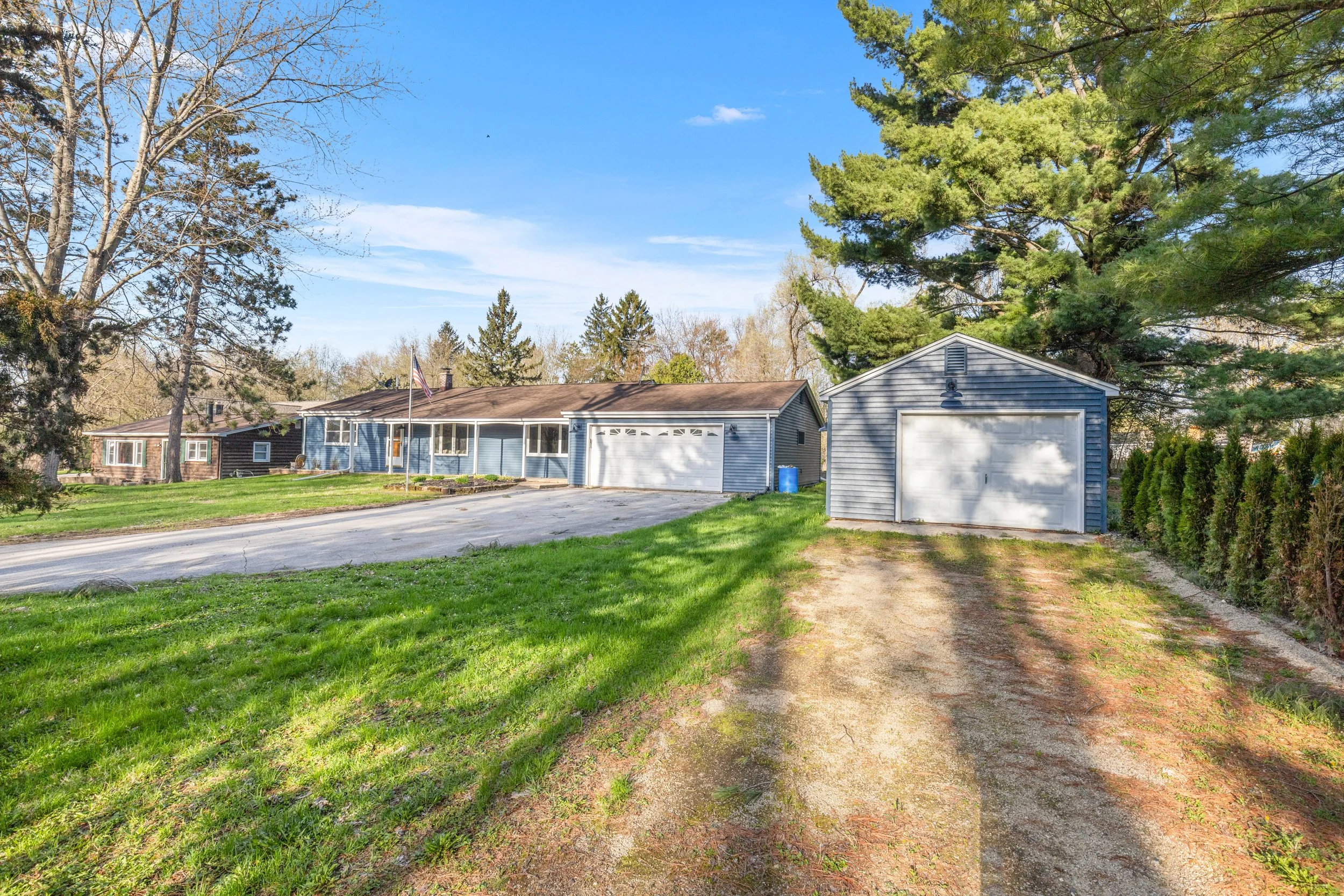 OPEN FOR BIDDING! Beautiful 3BR/2BA Home on Double Lot Near School Section Lake in Dousman