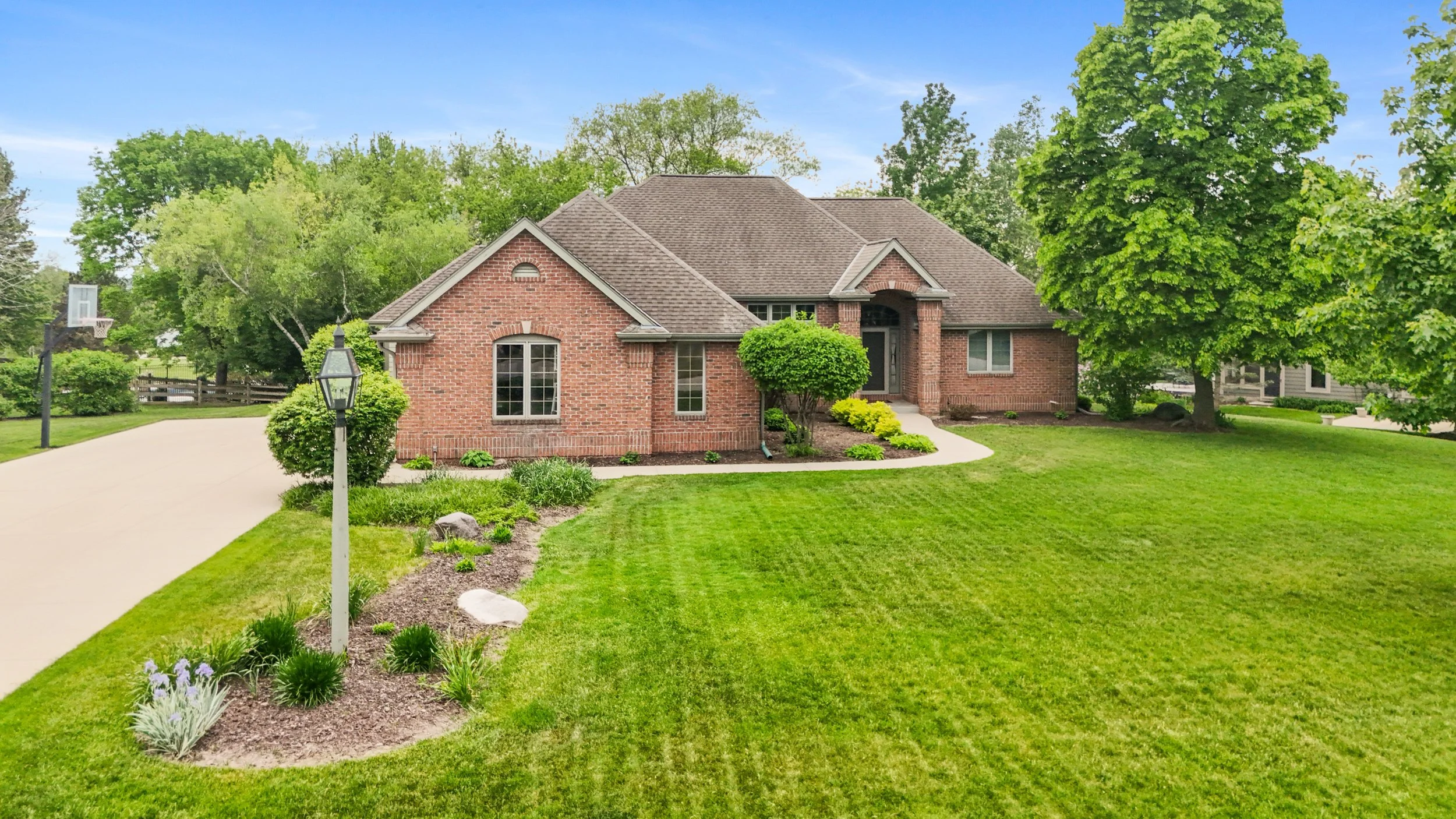 OPEN FOR BIDDING! Home in Pewaukee's Highly Desirable Steeplechase Subdivision
