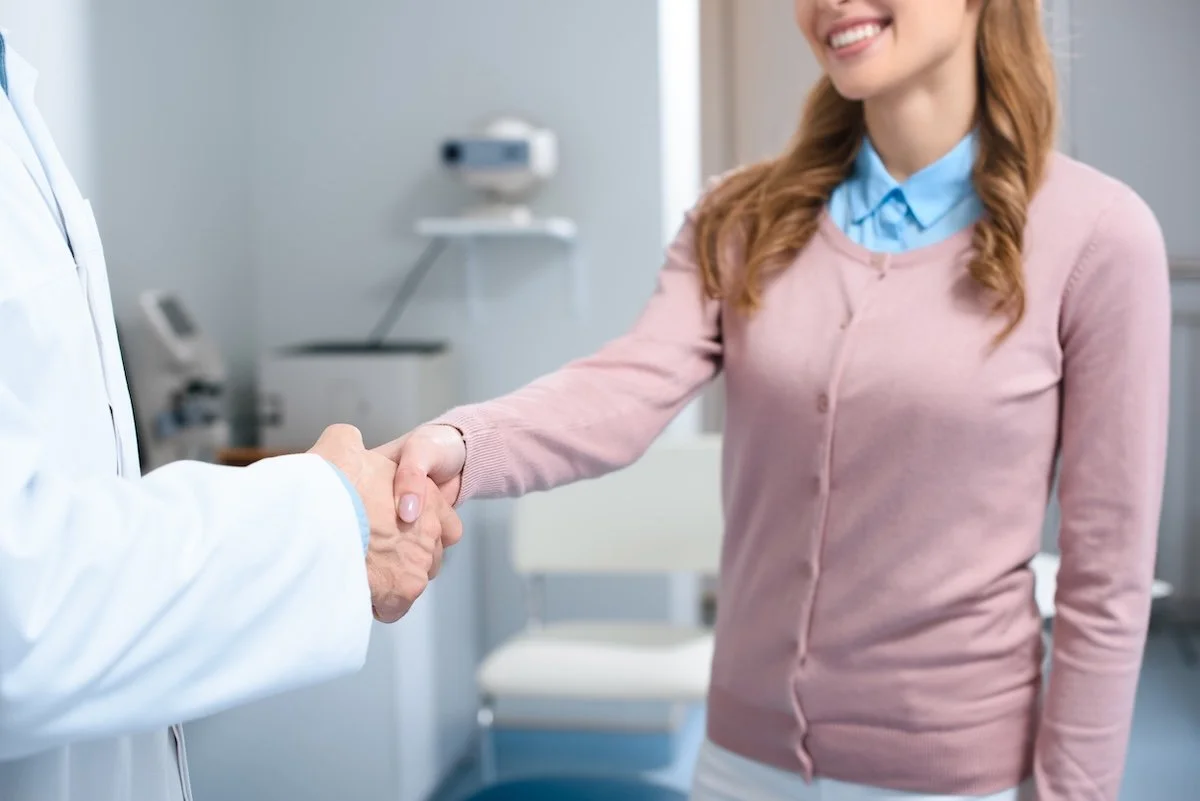 Dr. Brooks welcoming a new female patient to her practice in Roanoke, VA.