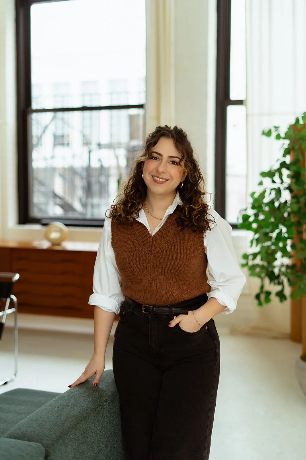 Alexa Keramidas, a white woman with curly hair, a clinical psychologist in Illinois specializing in anxiety, self-esteem, and body image